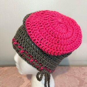 Handcrafted crochet slouchy beanie hat in colors of pink and grey.